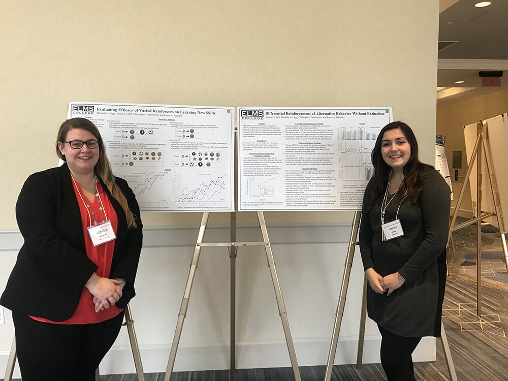 Photo of Applied Behavior Analysis grads Miranda Fogg and Alyssa Clark at an academic conference.