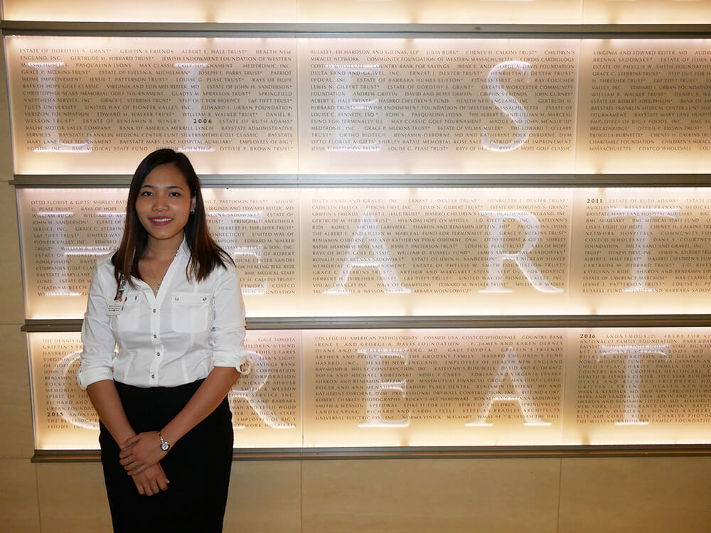 Photo of Tam Le, a graduate of the healthcare management program at Elms