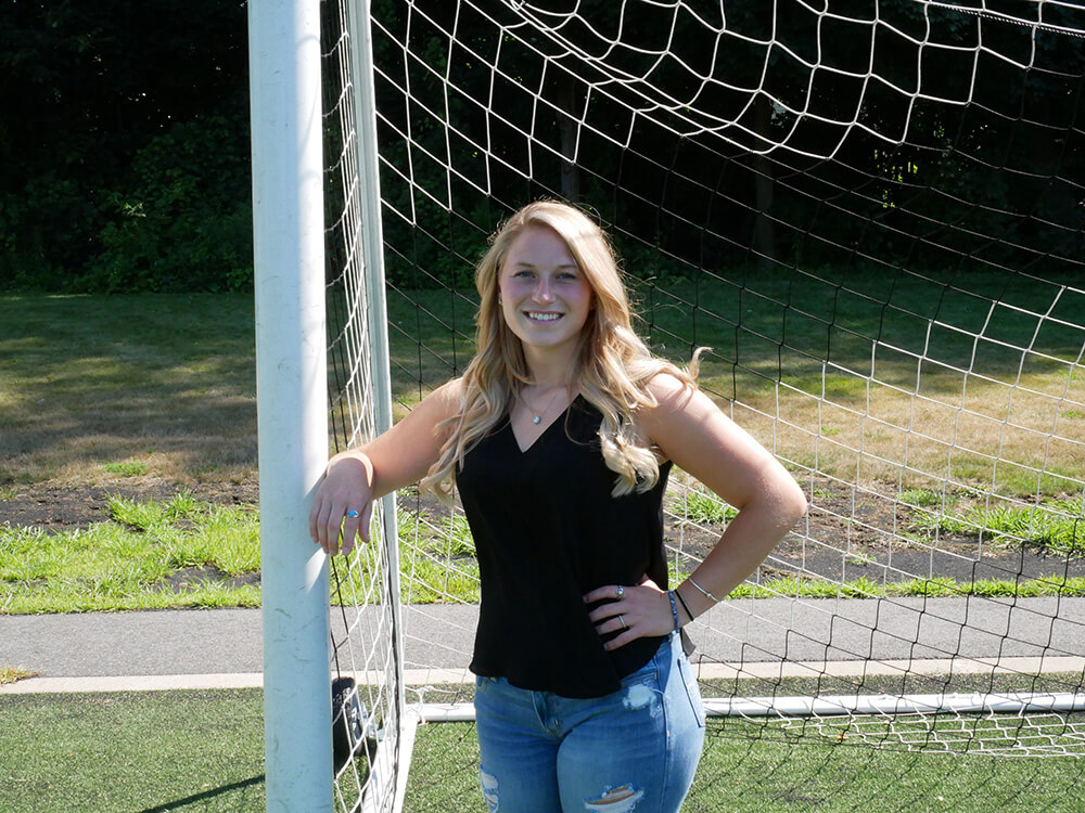 Photo of Rebecca Molin, a business management and marketing double major, and goalie of the women's soccer team