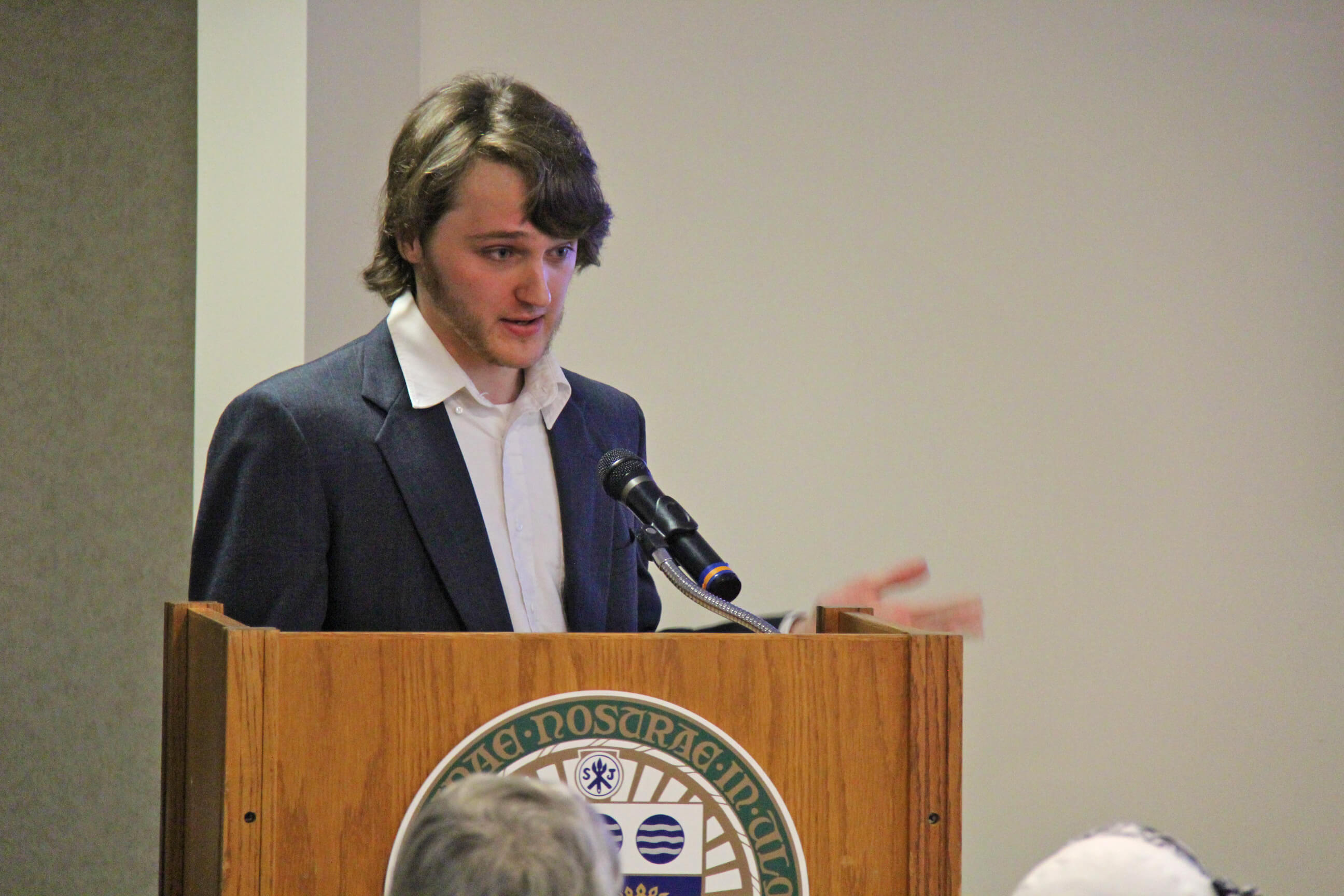 Photo of Ryan Shea presenting research at the inaugural Keating Schneider Experiential Learning Fund showcase