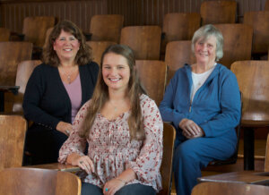 Photo of the Denault family; Tara Denault, M.Ed. ’96 (left), Shannon Denault ’19, and Joyce Denault ’60.