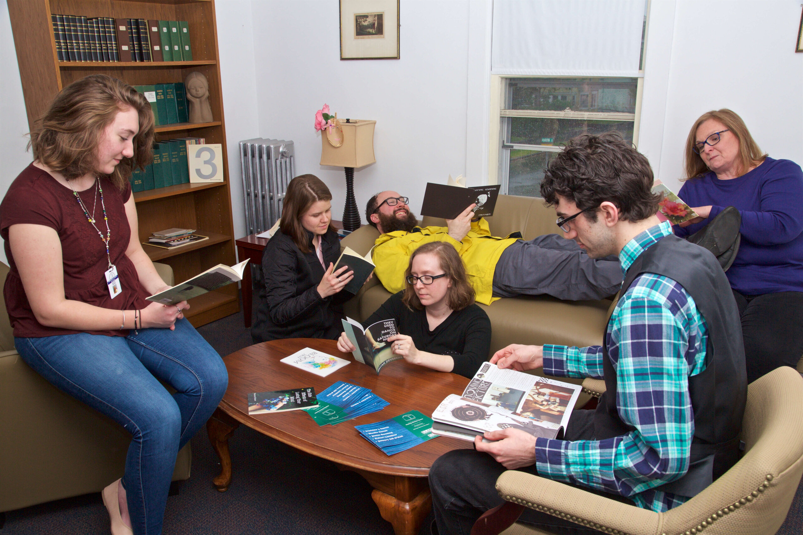Photo of students reading and meeting in the Blue House