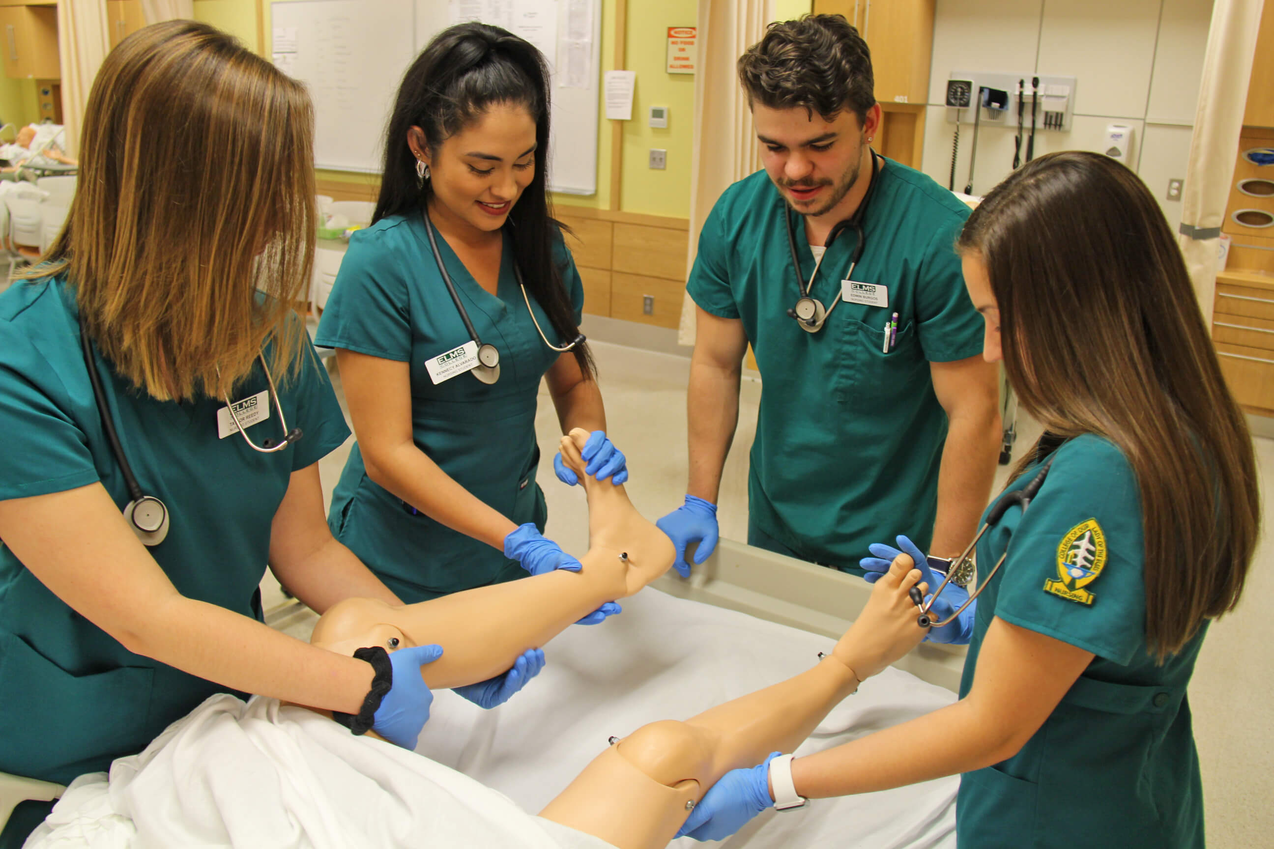 Photo of nursing students in the simulation lab; School of Nursing
