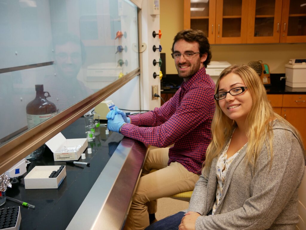 Photo of students in the research lab of the Lyons Center