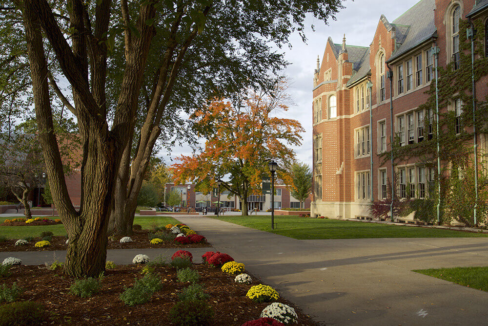 A photo of Berchmans Hall lawn in the fall
