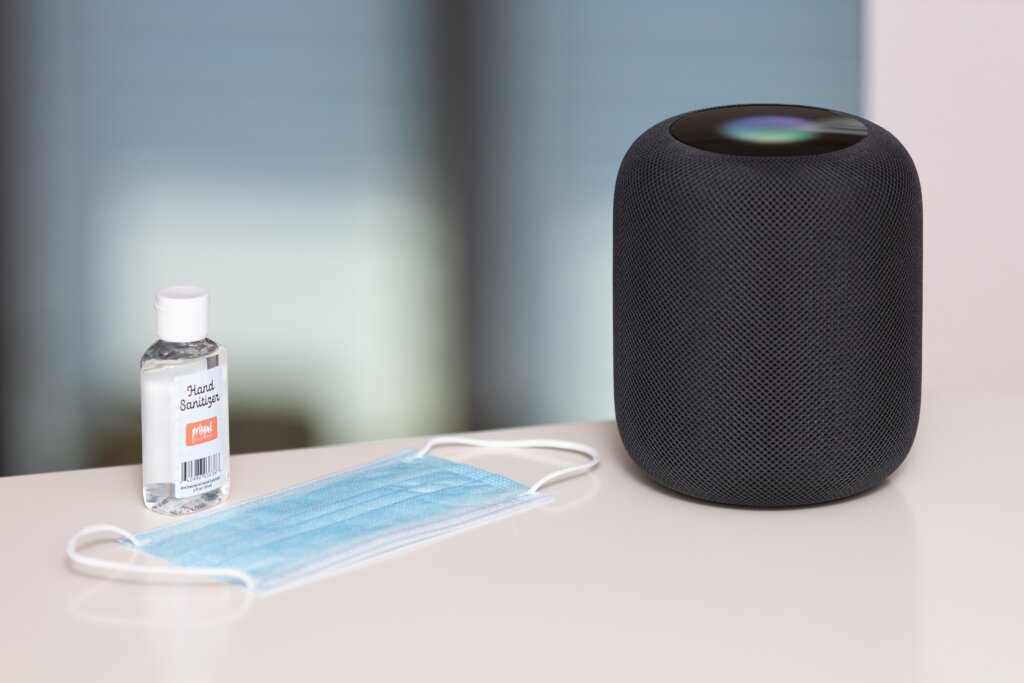 Photo of hand sanitizer, face mask, and Apple HomePod