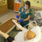 Photo of a nursing student in the skills lab