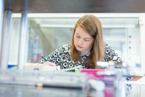 Photo of a student doing research in the Lyons Center research lab