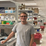 Photo of biology alumnus Michael Zulch '17 in the Larkin Lab at Boston University