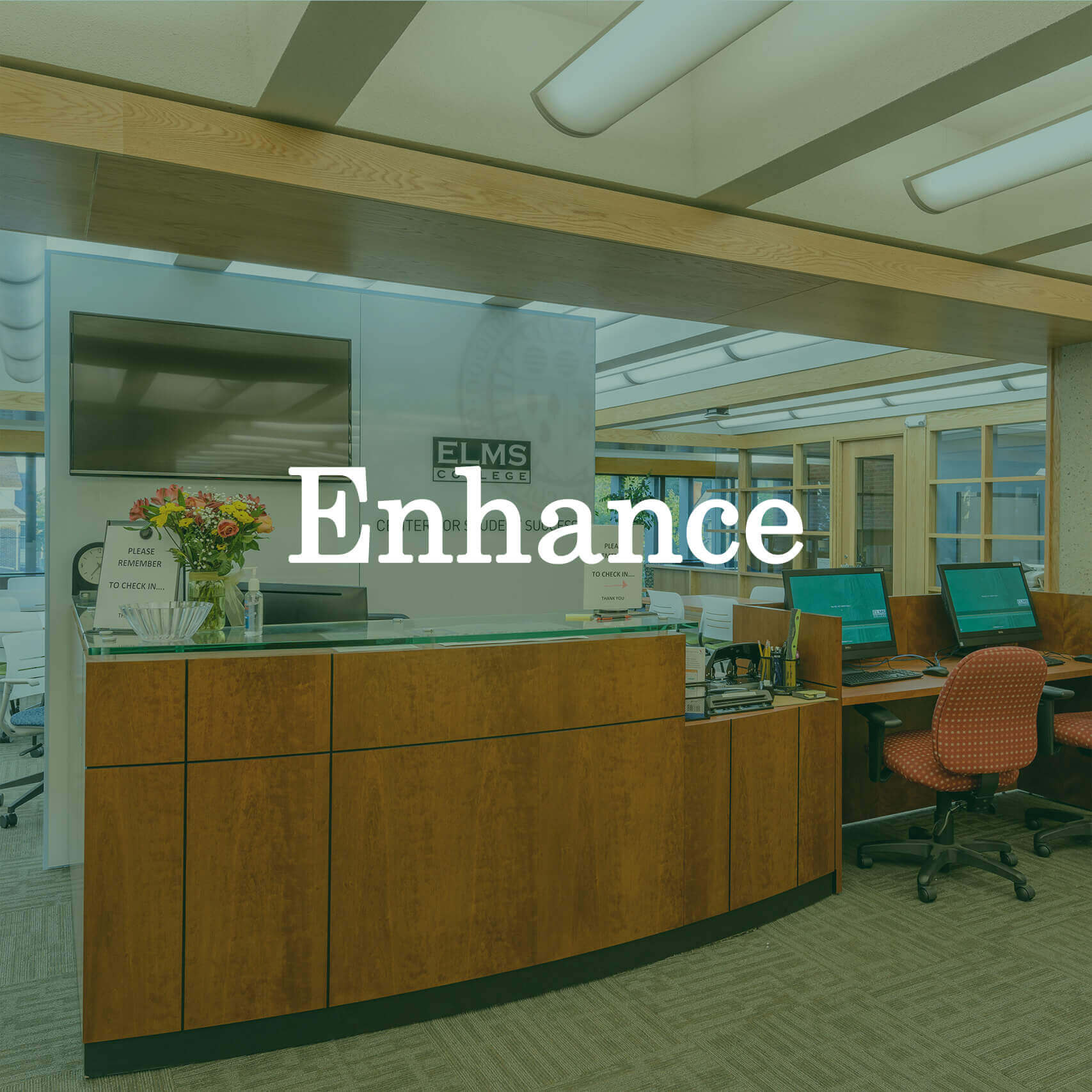 Photo of a desk at Elms College with a text overlay that reads "Enhance."
