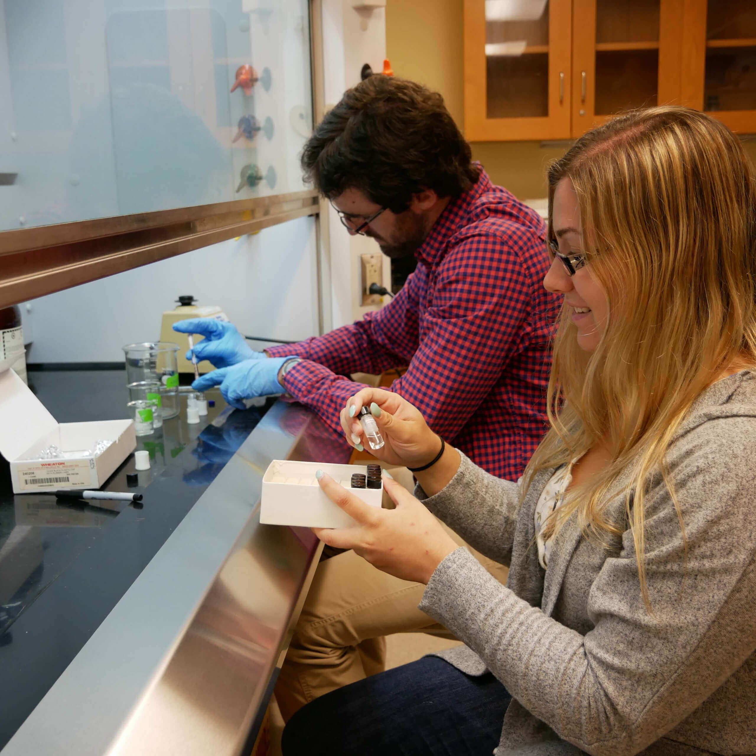 Students using science equipment 