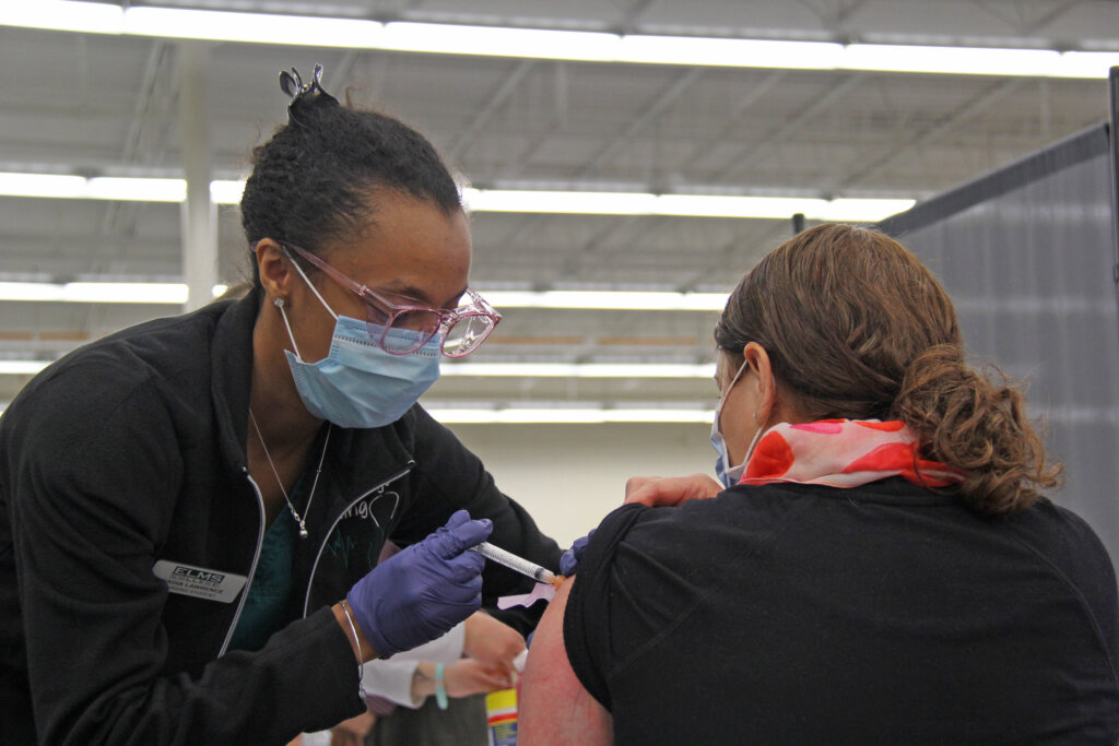 Photo of a nursing major at a COVID-19 clinic