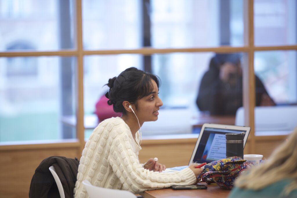 Photo of female student working on her laptop