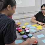 student reading with a teacher