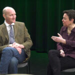 A photo of two professors conversing