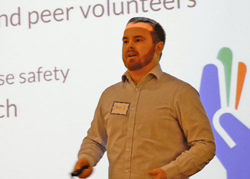 A photo of a male presenting a presentation