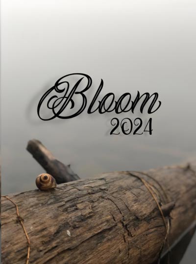 The cover of Bloom magazine 2024, a photo of a snail on a log by a river.