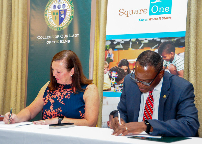 Photo of Harry E. Dumay, Ph.D., MBA, and Dawn DiStefano, signing the MOU