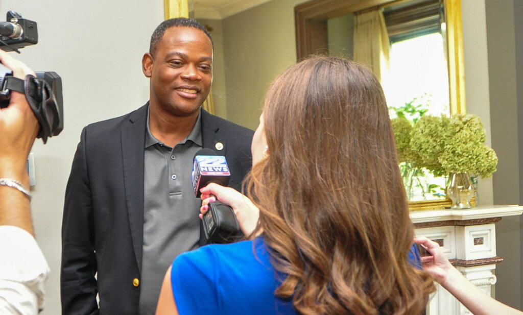 President Dumay speaks to reporters
