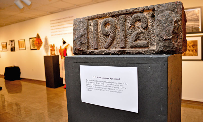 Photo of a brick from 1912 in a glass case