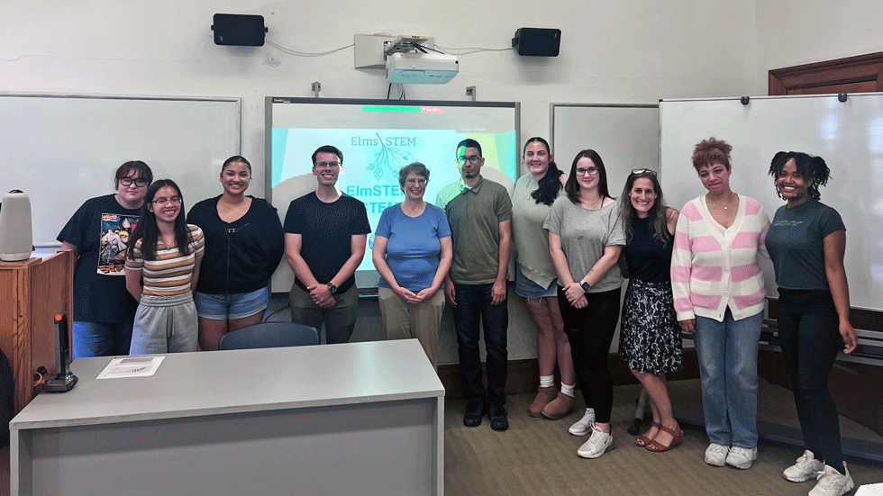 Photo of past S-STEM recipients: outside Lyon center at Elms College