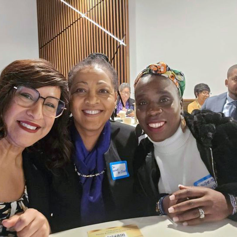 Photo of 3 women at a table