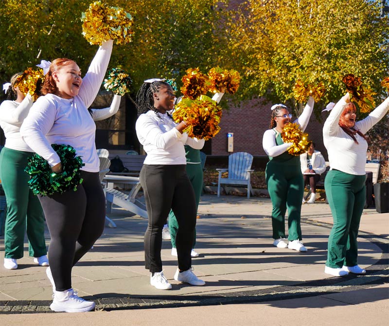 Photo of cheerleader students with pompoms