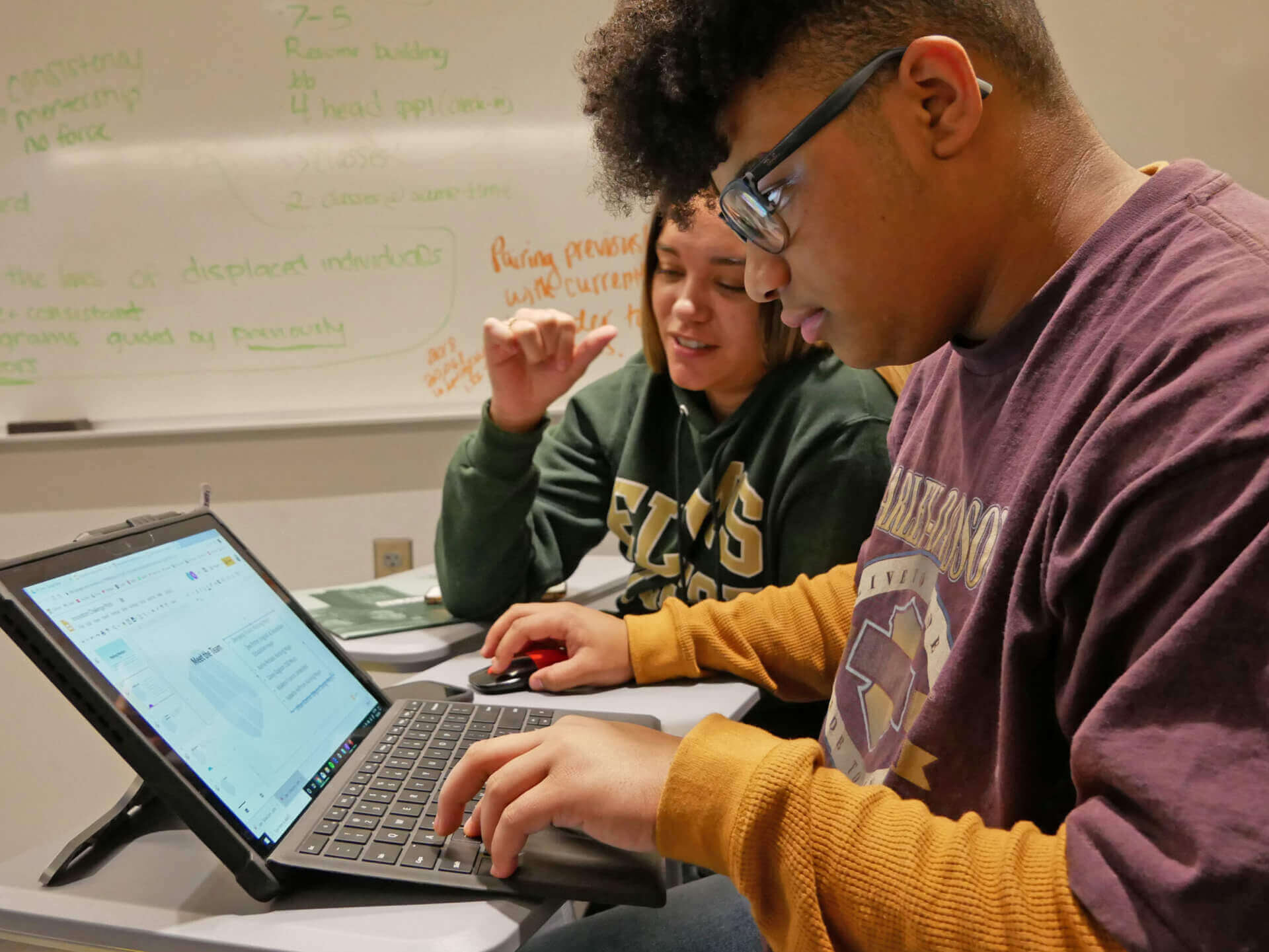 Photo of students working during the Innovation Challenge