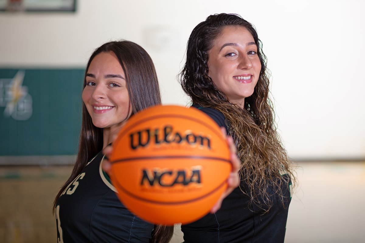 Photo of 2 female basketball players