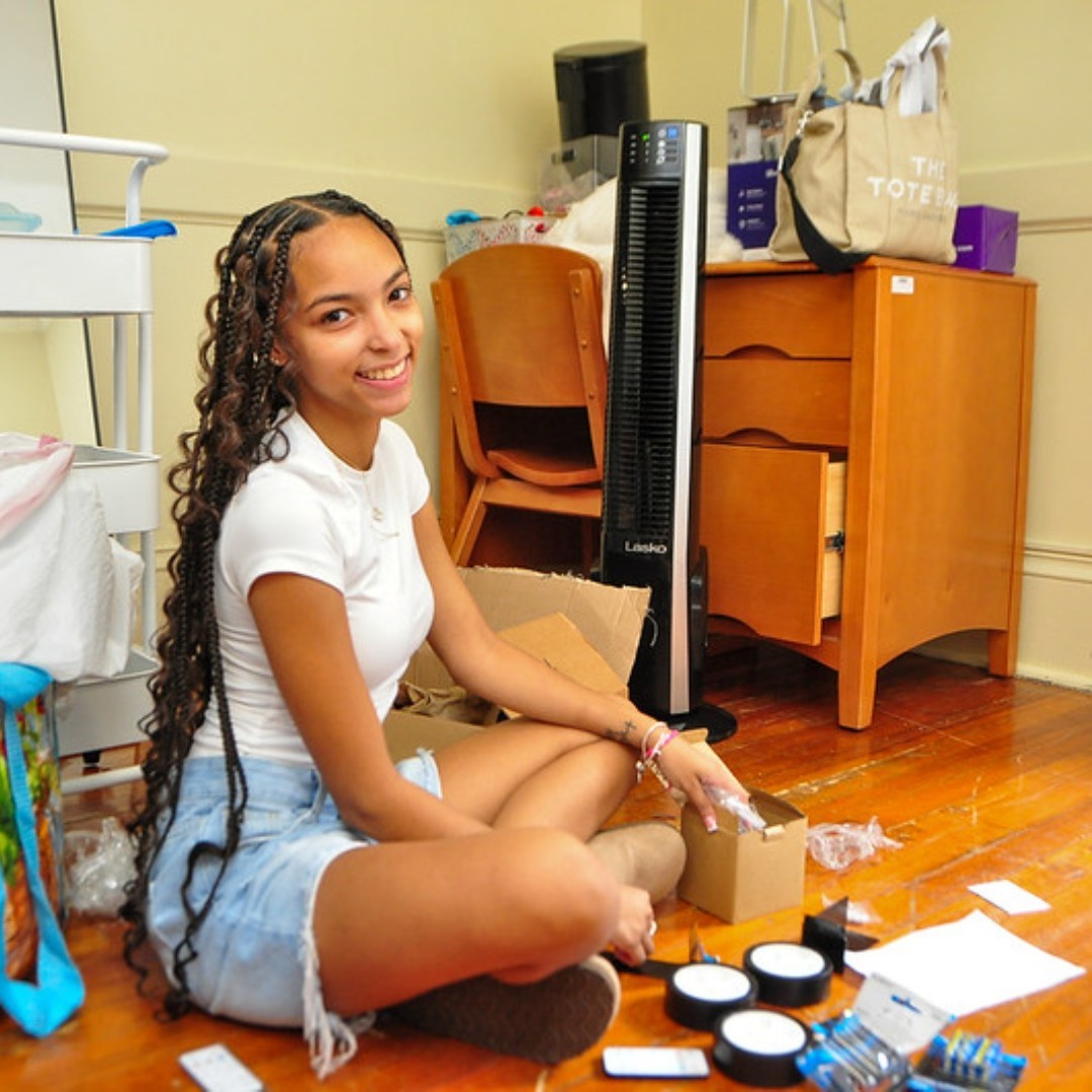 Photo of a student in a dorm room
