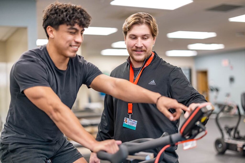 Photo of two men, one is a student and the other is an instructor