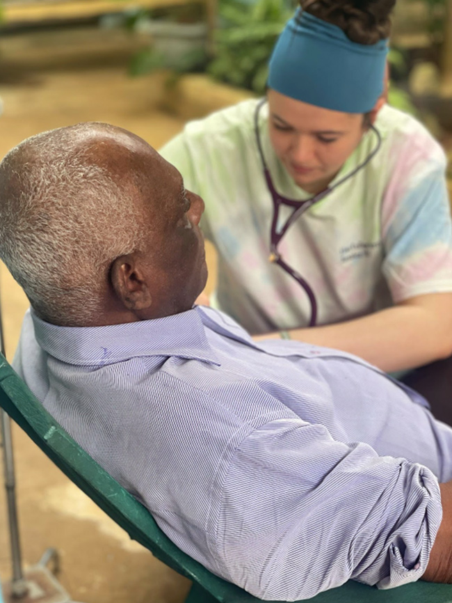 Photo of a woman and a man, Mission Trip to Jamaica, Elms College