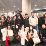 12 Students from the University of Kochi in Japan in an airport reception area with 3 Elms College staff