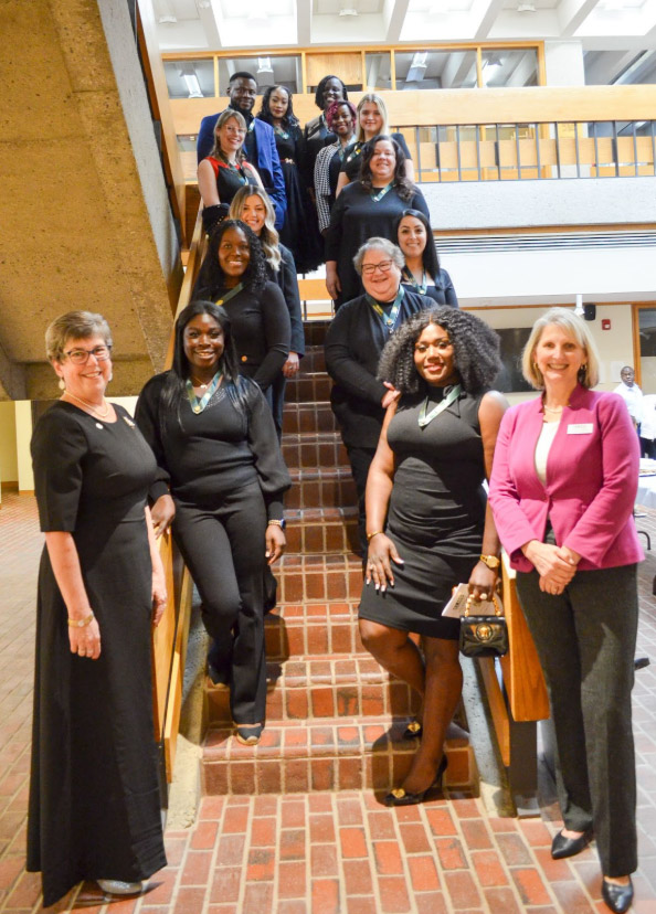 Photo of nurses standing on a staircase