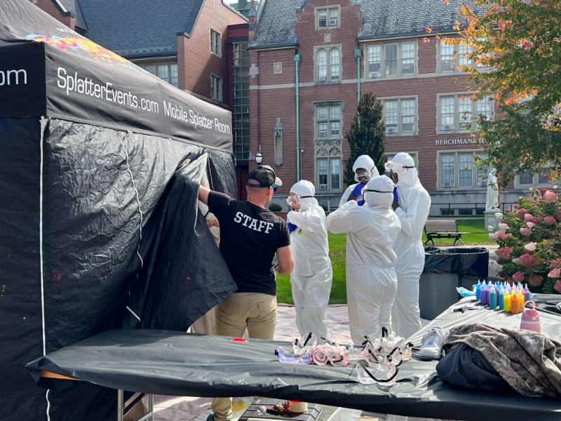 Photo of students entering a tent
