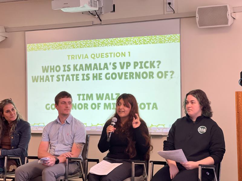 Photo of four people speaking at an event about climate change
