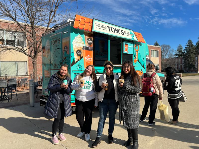 Photo of students in front of a food truck