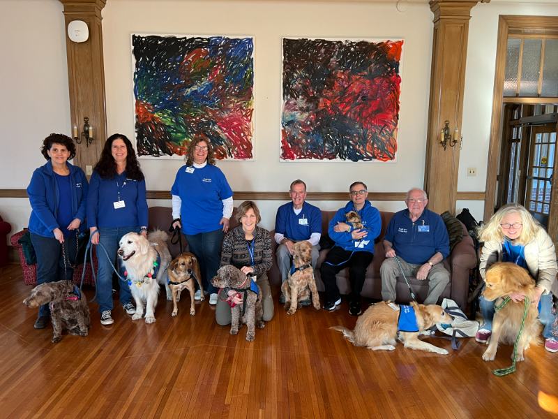 Group photo of students with therapy dogs