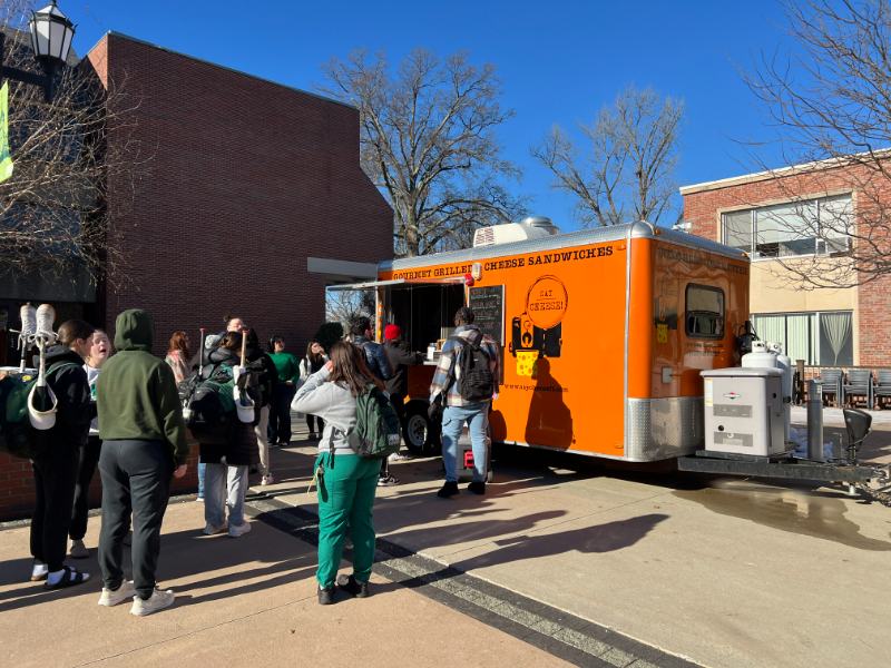 Photo of students gathered around a food truck