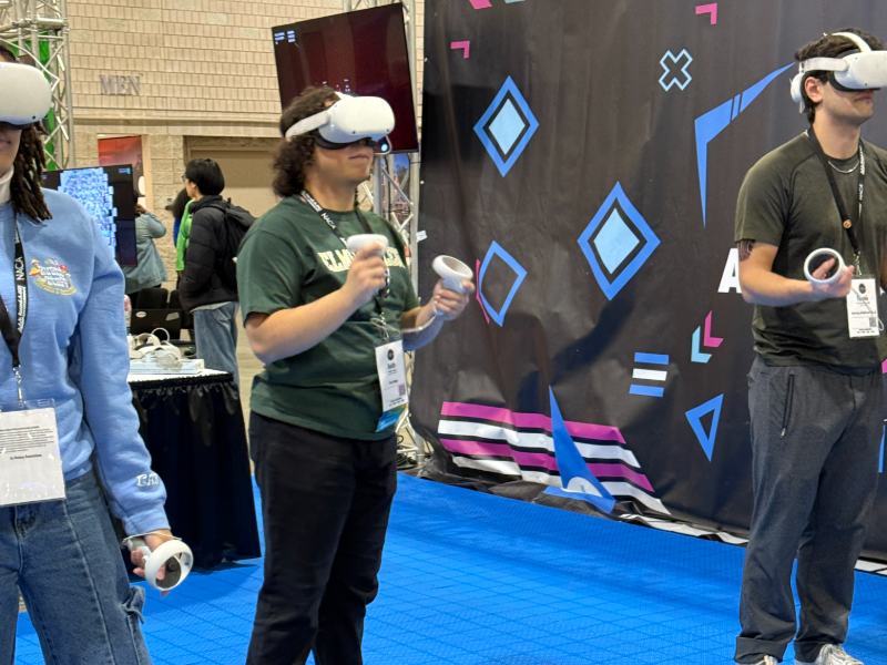Photo of students at an event using VR headsets
