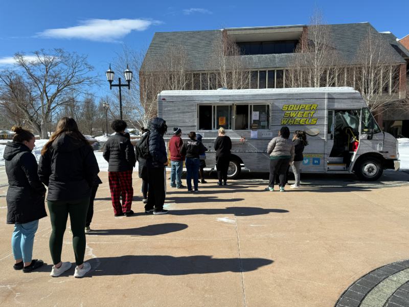 Photo of students in line for a food truck