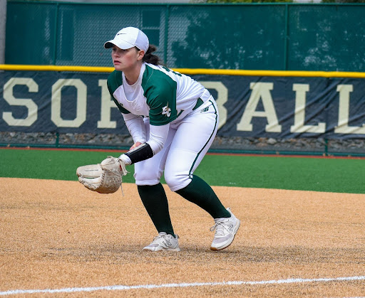 Photo of Katie Cosmos playing baseball