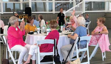 Photo of many people sitting at a table