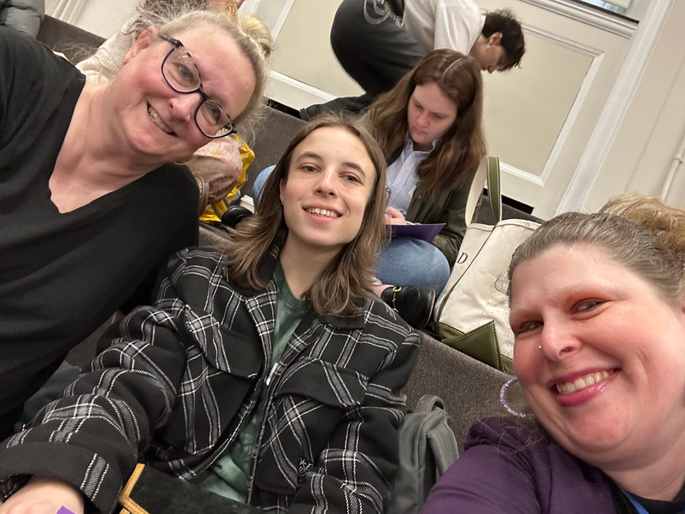 Photo of students and staff in a building