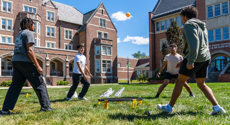 several students playing a game on the quad