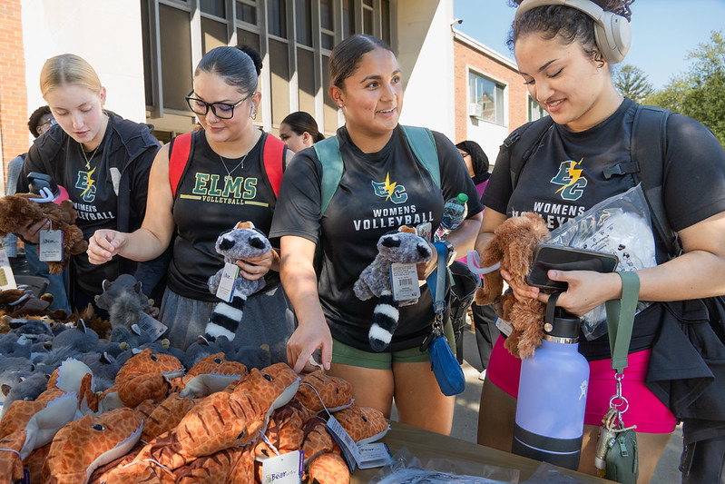 Several students getting stuffed animals