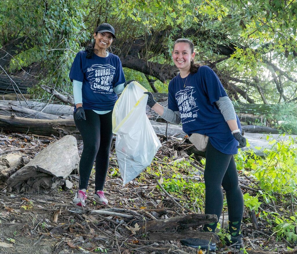 2 Elms College students cleaning up river