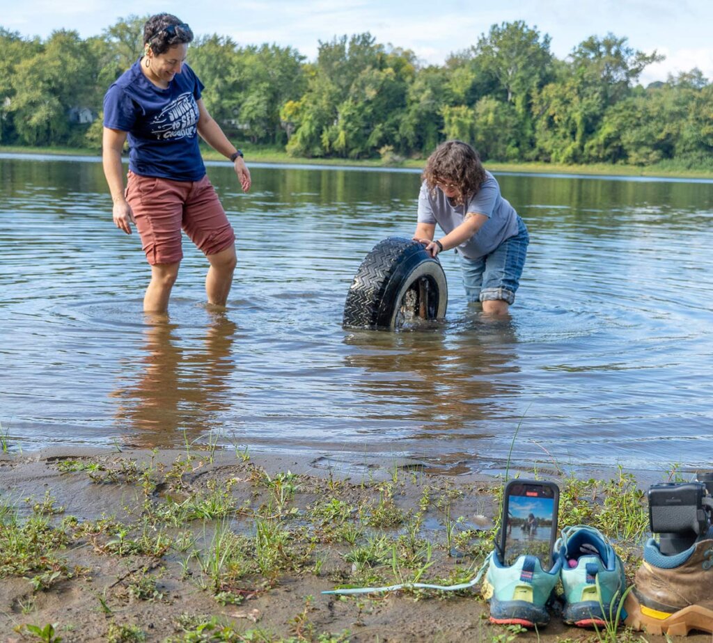 2 Elms College students cleaning up river