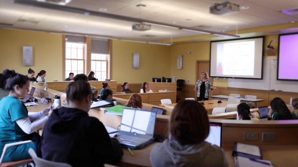 Photo of students at the firepit on the Keating Quad